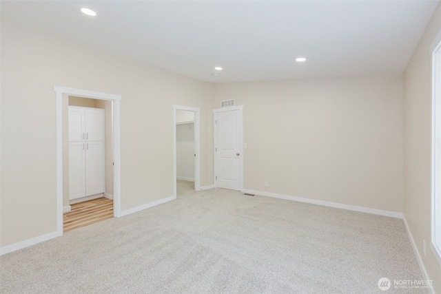 270 Granat St, Port Orchard, WA 98366 - unfurnished bedroom featuring light colored carpet, a spacious closet, recessed lighting, baseboards, and a closet