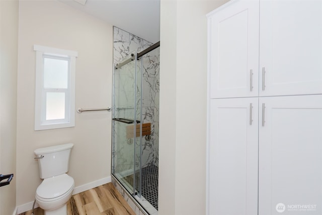 270 Granat St, Port Orchard, WA 98366 - bathroom with a marble finish shower, toilet, wood finished floors, and baseboards