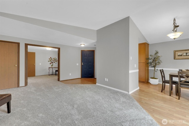 14426 55th Ave SE, Everett, WA 98208 - living room with baseboards, vaulted ceiling, and light wood finished floors