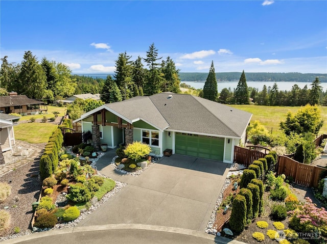 70 Ida Ct, Sequim, WA 98382 - single story home featuring an attached garage, driveway, a water view, and roof with shingles