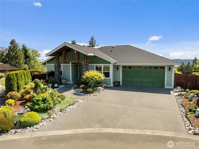 70 Ida Ct, Sequim, WA 98382 - view of front of property with a garage, concrete driveway, board and batten siding, and roof with shingles