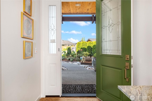 70 Ida Ct, Sequim, WA 98382 - doorway featuring baseboards and carpet