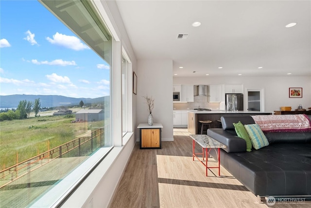 70 Ida Ct, Sequim, WA 98382 - living area with a mountain view, light wood-type flooring, plenty of natural light, and recessed lighting