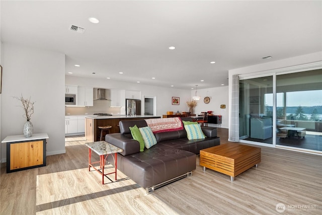 70 Ida Ct, Sequim, WA 98382 - living area featuring light wood-style floors, recessed lighting, and baseboards