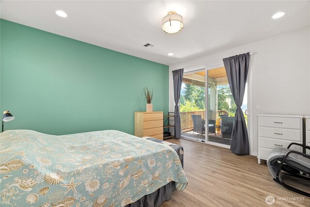 70 Ida Ct, Sequim, WA 98382 - bedroom featuring access to exterior, wood finished floors, and recessed lighting