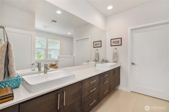 70 Ida Ct, Sequim, WA 98382 - bathroom featuring double vanity, tile patterned flooring, and recessed lighting