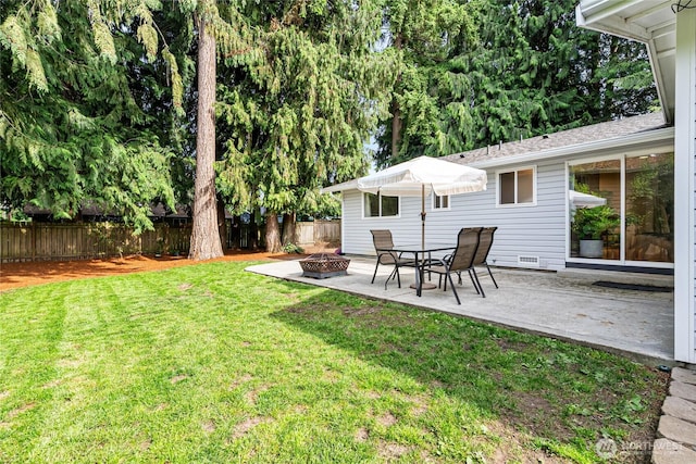26600 Weaver Ave NW, Poulsbo, WA 98370 - fenced backyard featuring an outdoor fire pit and a patio