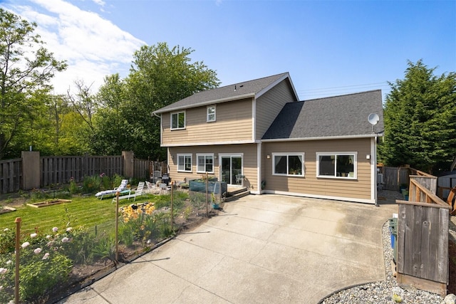 5695 Meadow View Dr, Ferndale, WA 98248 - rear view of house with a vegetable garden and a patio area