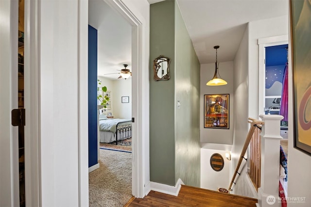 5695 Meadow View Dr, Ferndale, WA 98248 - hallway with an upstairs landing, baseboards, and wood finished floors