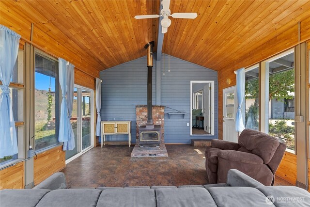 87 Vintin Rd, Carlton, WA 98814 - sunroom / solarium with a wood stove, vaulted ceiling, wood walls, ceiling fan, and wooden ceiling