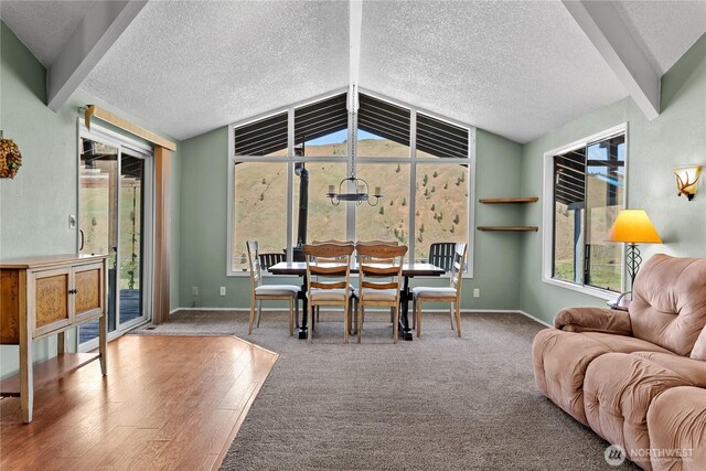 87 Vintin Rd, Carlton, WA 98814 - carpeted dining space featuring a textured ceiling, baseboards, and wood finished floors