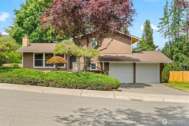 14208 NE 73rd St, Redmond, WA 98052 - view of front of home with a chimney and driveway