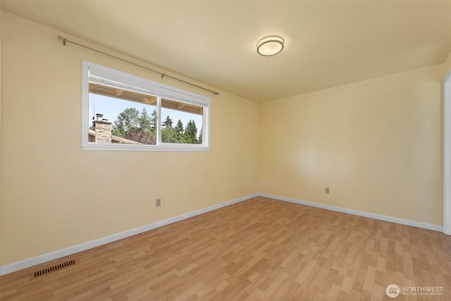 14208 NE 73rd St, Redmond, WA 98052 - spare room featuring light wood-type flooring and baseboards