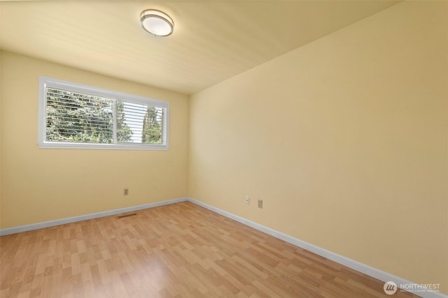 14208 NE 73rd St, Redmond, WA 98052 - spare room featuring light wood finished floors and baseboards