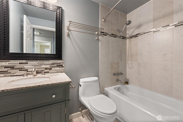 14208 NE 73rd St, Redmond, WA 98052 - bathroom with washtub / shower combination, toilet, vanity, and backsplash