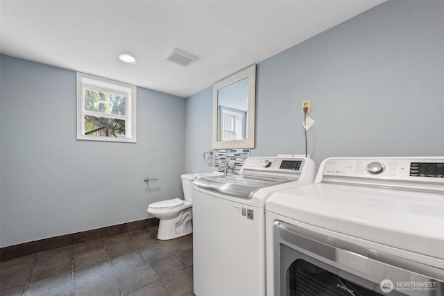 14208 NE 73rd St, Redmond, WA 98052 - washroom with baseboards and washer and dryer