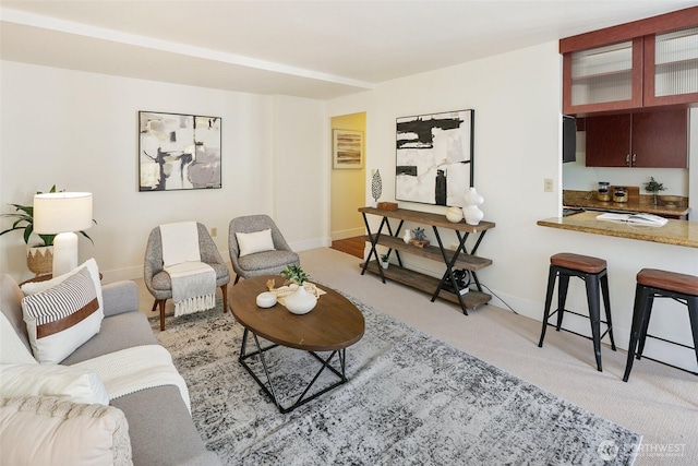 1105 Spring St Unit 712, Seattle, WA 98104 - living room with light carpet and baseboards