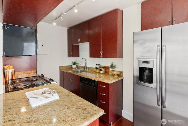1105 Spring St Unit 712, Seattle, WA 98104 - kitchen with appliances with stainless steel finishes, light stone counters, and track lighting