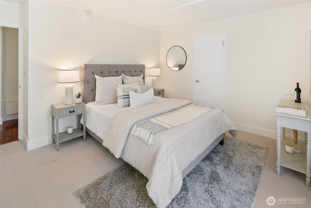 1105 Spring St Unit 712, Seattle, WA 98104 - bedroom featuring baseboards and light colored carpet