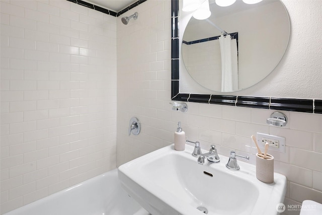 1105 Spring St Unit 712, Seattle, WA 98104 - full bathroom featuring shower / bath combination with curtain, tile walls, and tasteful backsplash