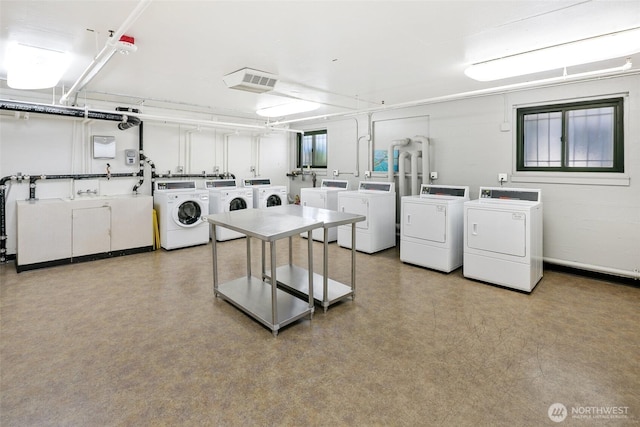1105 Spring St Unit 712, Seattle, WA 98104 - community laundry featuring washing machine and clothes dryer