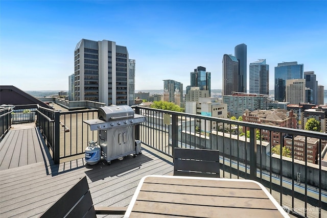 1105 Spring St Unit 712, Seattle, WA 98104 - deck with a grill and a view of skyline