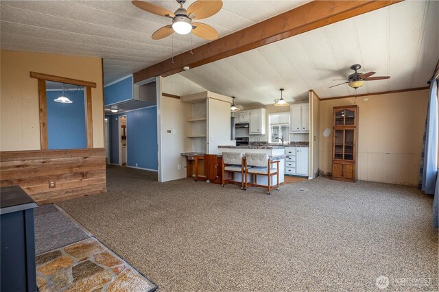 7515 Sunset Dr, Blaine, WA 98230 - kitchen featuring a ceiling fan, white cabinetry, a peninsula, open floor plan, and light colored carpet