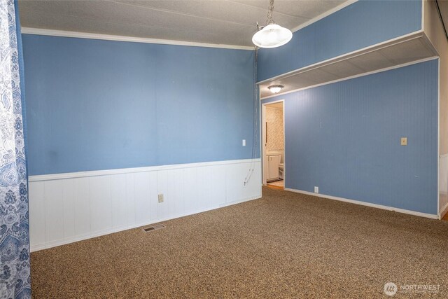 7515 Sunset Dr, Blaine, WA 98230 - empty room with wainscoting, ornamental molding, and carpet
