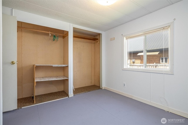 7515 Sunset Dr, Blaine, WA 98230 - unfurnished bedroom with concrete floors and a closet