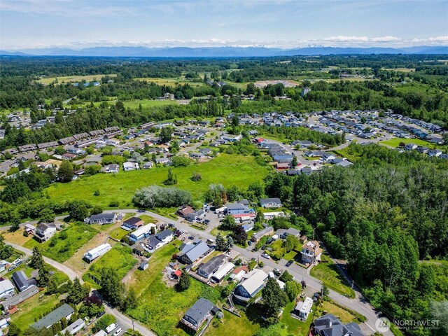 7515 Sunset Dr, Blaine, WA 98230 - aerial view of property's location with nearby suburban area and a heavily wooded area
