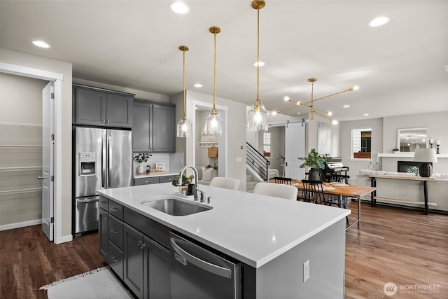 3998 Sawtooth Ct, Gig Harbor, WA 98332 - kitchen featuring stainless steel appliances, a sink, dark wood-type flooring, light countertops, and recessed lighting
