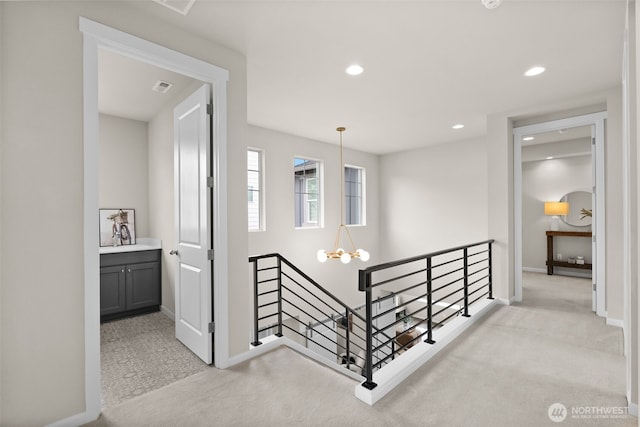 3998 Sawtooth Ct, Gig Harbor, WA 98332 - hallway with an upstairs landing, baseboards, carpet, recessed lighting, and a chandelier