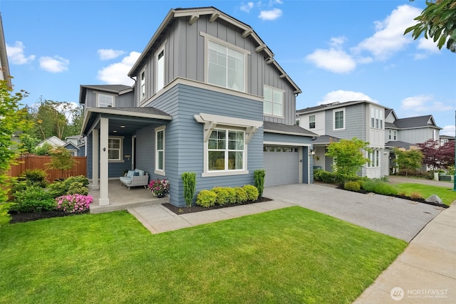 3998 Sawtooth Ct, Gig Harbor, WA 98332 - view of front facade featuring board and batten siding, an attached garage, and concrete driveway