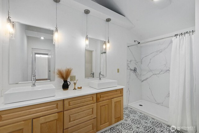 11613 SW Shawnee, Vashon, WA 98070 - full bathroom with double vanity, a marble finish shower, and tile patterned floors