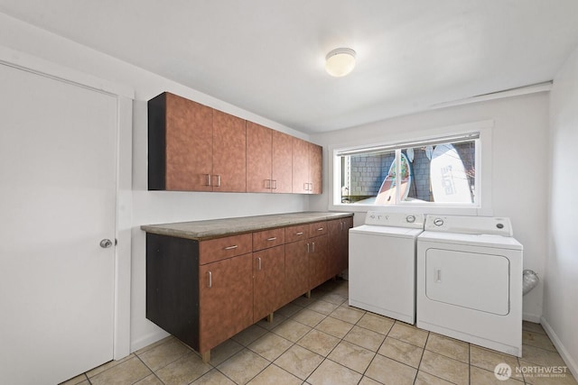 11613 SW Shawnee, Vashon, WA 98070 - laundry room featuring cabinet space, washer and clothes dryer, and light tile patterned floors