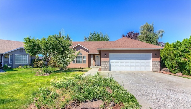 1620 S 68th Ave, Yakima, WA 98908 - ranch-style home featuring brick siding, driveway, a garage, and a front lawn