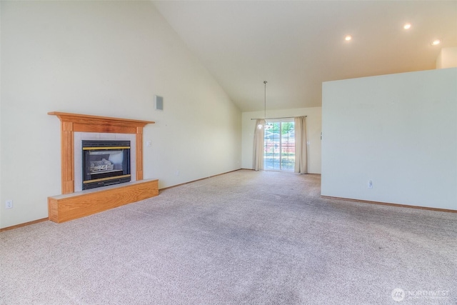 1620 S 68th Ave, Yakima, WA 98908 - unfurnished living room featuring high vaulted ceiling, light colored carpet, a tiled fireplace, and recessed lighting