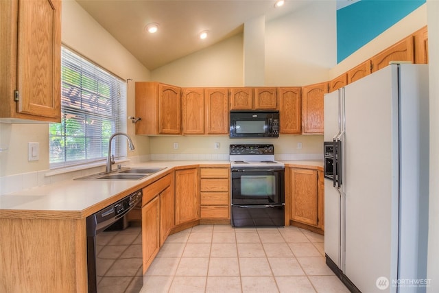 1620 S 68th Ave, Yakima, WA 98908 - kitchen with black appliances, light countertops, light tile patterned floors, recessed lighting, and high vaulted ceiling