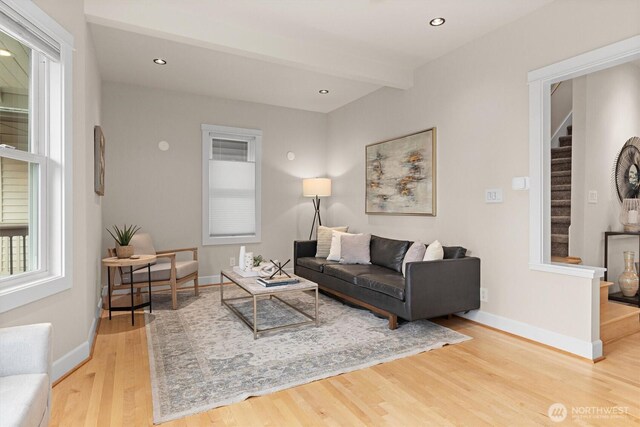 1218 NE 69th St, Seattle, WA 98115 - living room featuring wood finished floors, stairs, baseboards, and recessed lighting