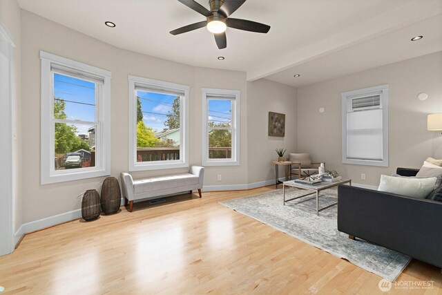 1218 NE 69th St, Seattle, WA 98115 - living area with plenty of natural light, baseboards, wood finished floors, ceiling fan, and beamed ceiling