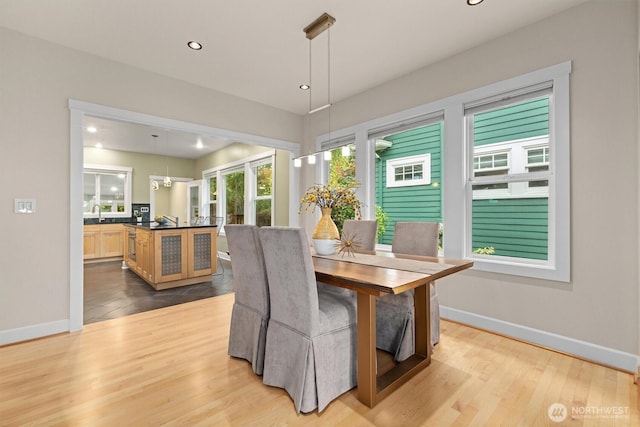 1218 NE 69th St, Seattle, WA 98115 - dining room with recessed lighting, baseboards, and wood finished floors