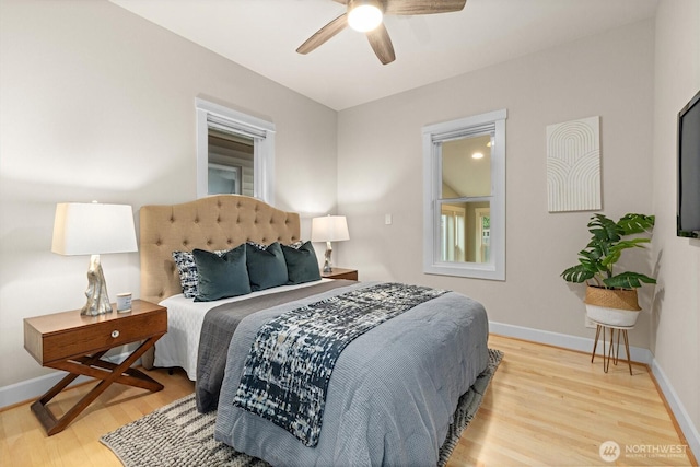 1218 NE 69th St, Seattle, WA 98115 - bedroom with wood finished floors, baseboards, and a ceiling fan