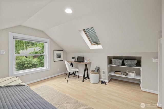 1218 NE 69th St, Seattle, WA 98115 - office featuring wood finished floors, vaulted ceiling, a skylight, baseboards, and built in features