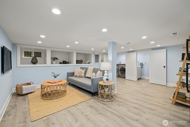 1218 NE 69th St, Seattle, WA 98115 - living room featuring washer / dryer, light wood-style flooring, baseboards, and recessed lighting