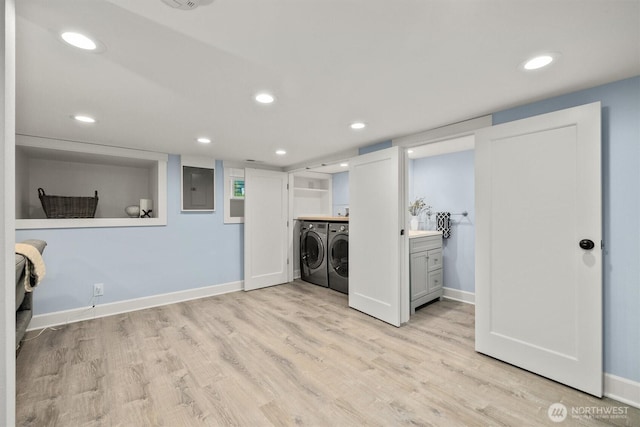 1218 NE 69th St, Seattle, WA 98115 - laundry area featuring separate washer and dryer, electric panel, light wood-style floors, baseboards, and recessed lighting