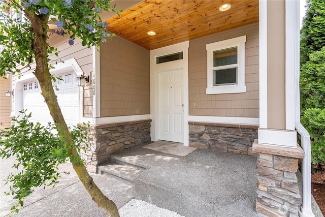 14808 26th Pl W Unit 2, Lynnwood, WA 98087 - doorway to property featuring stone siding and a garage