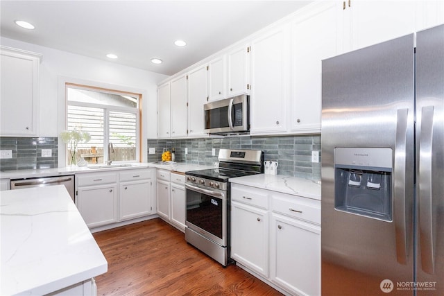 14808 26th Pl W Unit 2, Lynnwood, WA 98087 - kitchen featuring stainless steel appliances, white cabinetry, light stone countertops, and recessed lighting