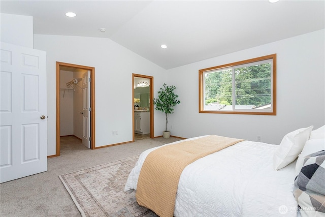 14808 26th Pl W Unit 2, Lynnwood, WA 98087 - bedroom featuring lofted ceiling, light carpet, a walk in closet, recessed lighting, and ensuite bath