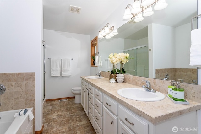 14808 26th Pl W Unit 2, Lynnwood, WA 98087 - full bath with double vanity, a garden tub, a stall shower, stone finish floors, and a chandelier