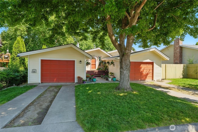 513 SE Highland Park Dr, College Place, WA 99324 - view of front facade featuring driveway, an outbuilding, and a garage
